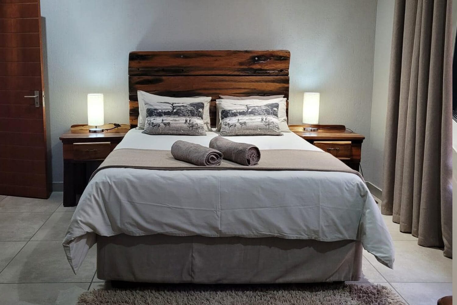 Live edge sleeperwood coffee table with unique natural curves and a polished finish, adding a touch of nature to the living room.