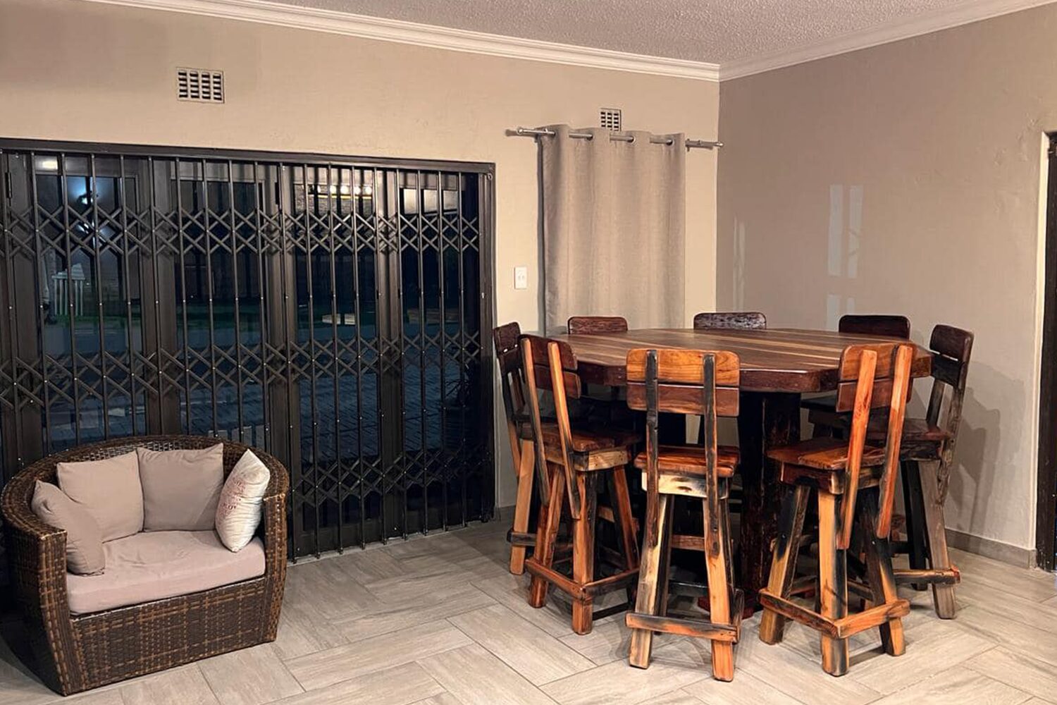 Spacious sleeperwood dining table with a smooth surface and sturdy legs, ideal for family gatherings and dinner parties.