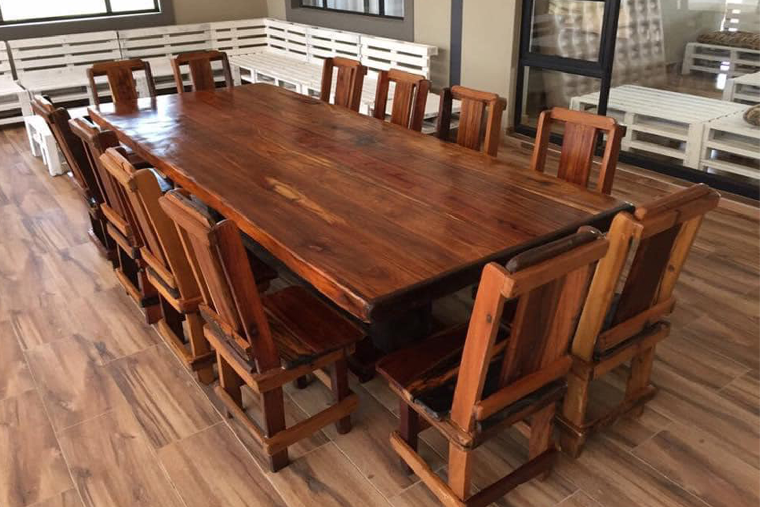 Spacious sleeperwood dining table with a smooth surface and sturdy legs, ideal for family gatherings and dinner parties.